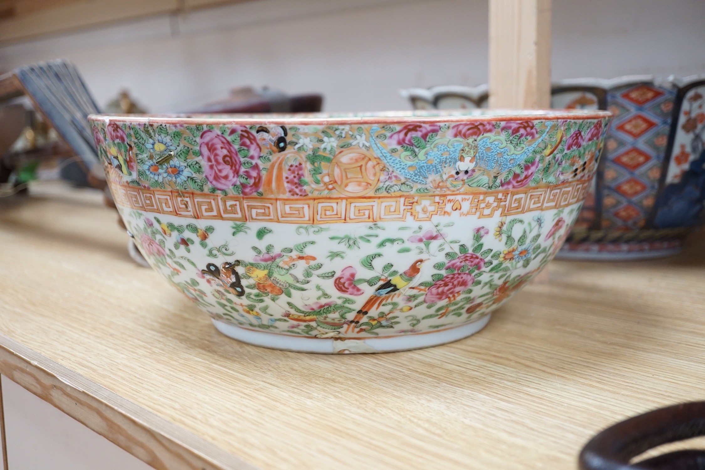 A 19th century Imari bowl, a famille rose bowl and one other- all damaged
